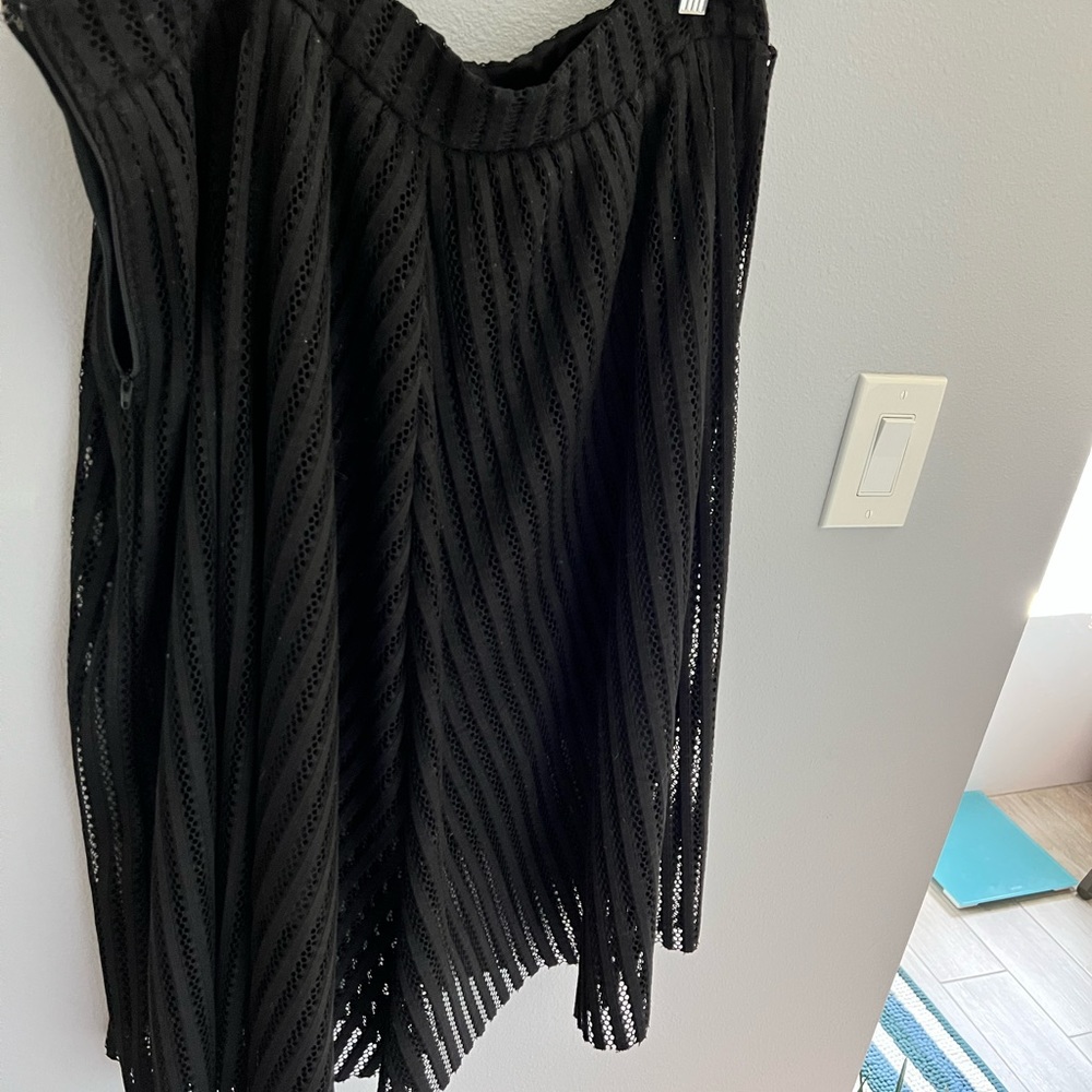 Torrid gently used skirt. Fish net like material with an under skirt.